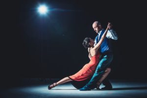 Woman And Man Dancing Under Light